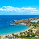 View of Lindos beach with village of Lindos and Acropolis in background (Rhodes, Greece)